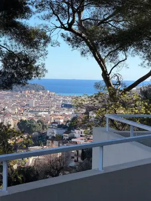 a view of the city from the balcony of a house at Appartement 3 chambres avec piscine et parking privé in Nice