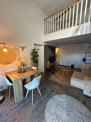 a bathroom with a tub and a sink and a mirror at Duplex close to the sea with parking in Nice