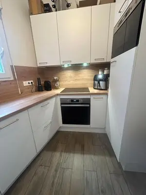 a bedroom with a bed and a staircase at Duplex close to the sea with parking in Nice