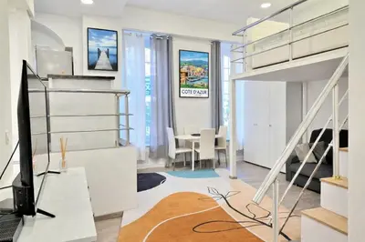 a living room with a loft bed and a desk at Cœur de Nice à 350m de la mer in Nice