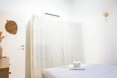 a bathroom with a bed with a towel on it at Duplex carré d'or au calme sur cour 100m de la plage in Nice