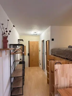 a room with a bunk bed and a ladder at Charmant Studio Proche Plage et Transport in Saint-Laurent-du-Var
