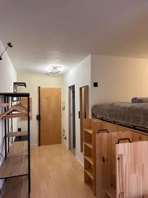 a room with a bunk bed and a staircase at Charmant Studio Proche Plage et Transport in Saint-Laurent-du-Var