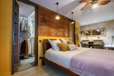 a bedroom with a large bed and a closet at Loft proche du port de Nice - 6 pers - Parking in Nice