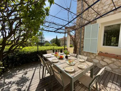 a living room with a couch and a fireplace at VILLA ANGEL VI4481 By Riviera Holiday Homes in Èze