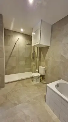 a bathroom with a toilet and a shower and a sink at Chateauneuf in Nice