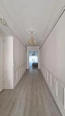an empty room with a white ceiling and a long hallway at Chateauneuf in Nice