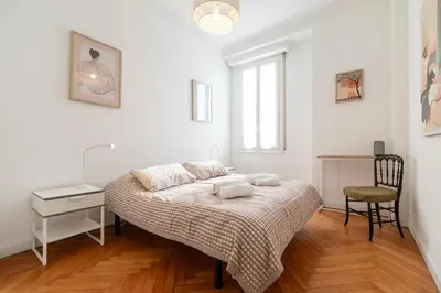 a bedroom with a bed and a desk and a chair at Maison Bianchi - Durante - downtown in Nice
