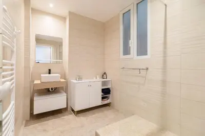 a white bathroom with a sink and a shower at Maison Bianchi - Durante - downtown in Nice