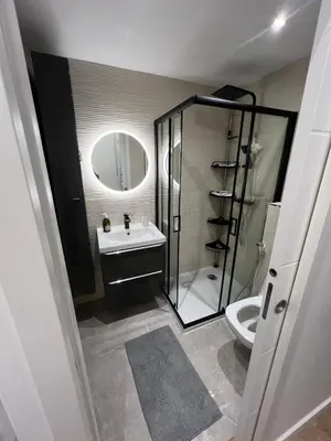 a bathroom with a shower and a sink and a toilet at Appartement vieux Nice in Nice