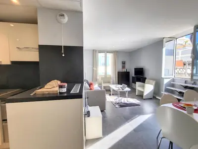 a kitchen and living room with a counter and a living room at Nestor&Jeeves - ALPHONSE KARR TERRASSE - Hyper center - Close sea - Chic street in Nice
