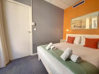 a bedroom with two beds with towels on them at Nestor&Jeeves - ALPHONSE KARR TERRASSE - Hyper center - Close sea - Chic street in Nice