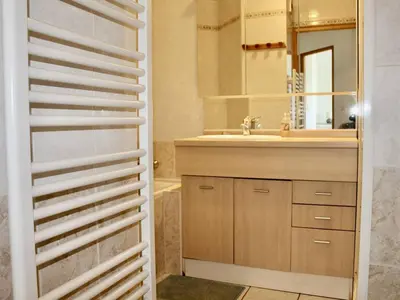 a bathroom with a sink and a mirror at Appartement refait à neuf, climatisé - familles - FR-1-252A-143 in Cagnes-sur-Mer
