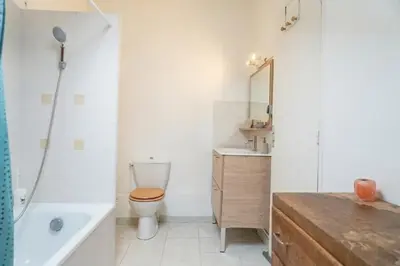 a bathroom with a toilet and a sink and a tub at Doux Pavillon - La Dolce Riviera in Nice