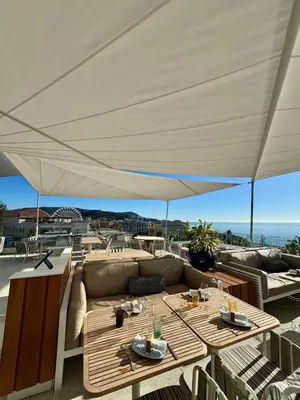 a view of a city with the ocean and buildings at Bijoux de carré d'or in Nice