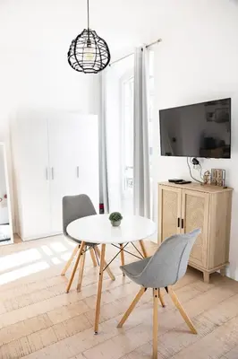 a living room with a couch and a window at Cozy apartment Nice center in Nice