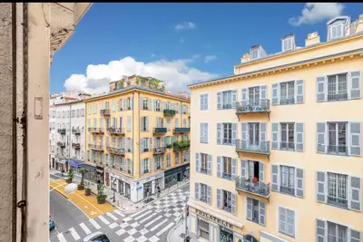 a bathroom with a white toilet and a sink at Cozy apartment Nice center in Nice