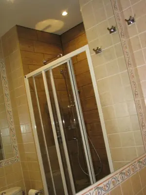 a shower with a glass door in a bathroom at Appartamento in rue Halevy in Nice