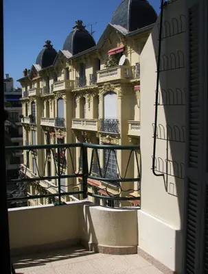 a large building with balconies and a balcony at Appartamento in rue Halevy in Nice