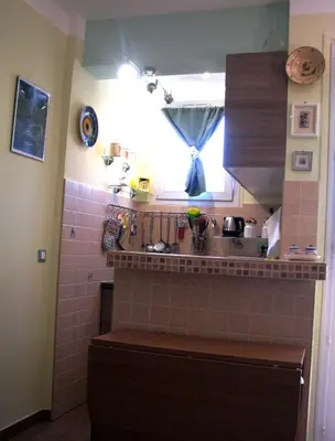 a small kitchen with a sink and a window at Appartamento in rue Halevy in Nice