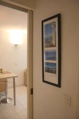 a picture hanging on a wall in a room at Le 7 Augustin in Nice