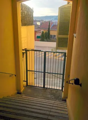 a balcony with a view of a body of water at Le 7 Augustin in Nice