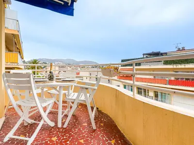 a table and chairs on the balcony of a building at Apartment Saint Christophe by Interhome in Nice