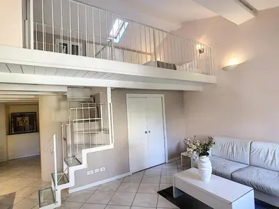 a living room with a staircase and a couch at Nestor&Jeeves - LE DUPLEX - Central - Very close sea in Nice
