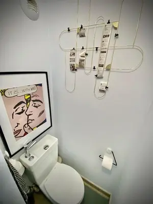 a bathroom with a white toilet and a picture at Unique Apartment - Costa Plana in Cap d'Ail