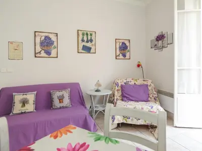 a room with a bed and a chair at La Romantica Dante Five stars Holiday House in Nice