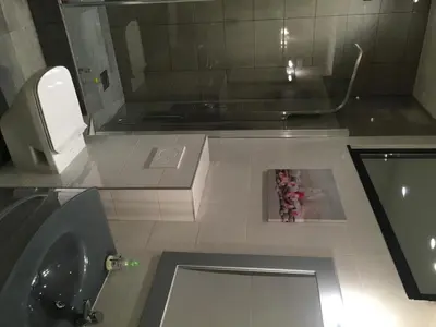 a bathroom with a sink and a toilet and a mirror at Gallo Comfort in Nice