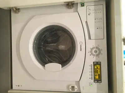 a white washing machine with its door open at Gallo Comfort in Nice