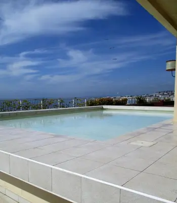 a large swimming pool on the roof of a building at Le Paradis Blue in Nice