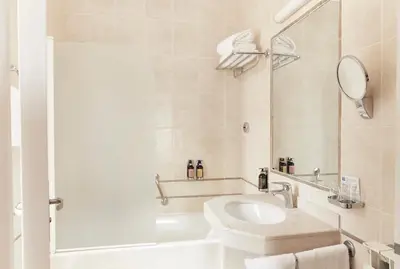a bathroom with a toilet and a sink at Welcome Hotel in Villefranche-sur-Mer