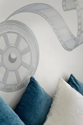 a room with pillows and a wheel on the wall at Welcome Hotel in Villefranche-sur-Mer