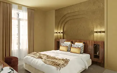 a bedroom with a large bed with a large headboard at Hotel Gounod Fully Renovated in Nice