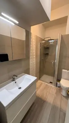 a bathroom with a sink and a shower and a toilet at 2 Bedrooms Appartement In Central Location on the famous Place Massena Nice in Nice