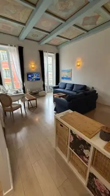 a living room with a couch and a table at 2 Bedrooms Appartement In Central Location on the famous Place Massena Nice in Nice