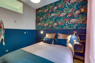 a living room with a flat screen tv and a mirror at CASA NISSARTE - Central near Train station - PARKING - confort & cosy- AC in Nice