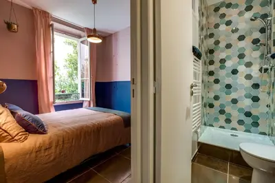 a bathroom with a sink and a mirror at CASA NISSARTE - Central near Train station - PARKING - confort & cosy- AC in Nice