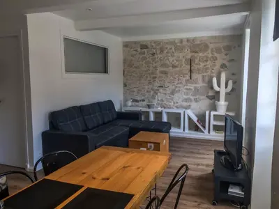 a living room with a couch and a table at Nicolago in Nice