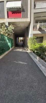 an empty street in a building with a tunnel at Studio dans la Villa 