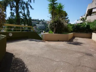 a parking lot with a view of a city at Nice-Miramar Apartment and Parking in Nice