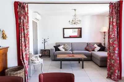 a living room with a couch and a table at Le Lympia in Nice