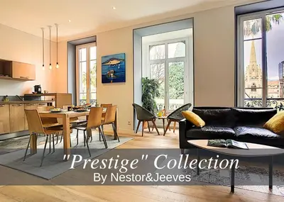 a living room with a couch and a table at Nestor&Jeeves - PALAIS MARIE PRESTIGE - Central - Close sea in Nice