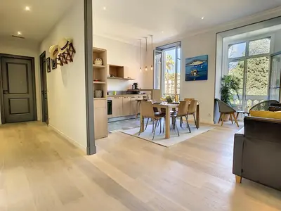 a kitchen and dining room with a table and chairs at Nestor&Jeeves - PALAIS MARIE PRESTIGE - Central - Close sea in Nice