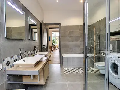 a bathroom with two sinks and a washing machine at Nestor&Jeeves - PALAIS MARIE PRESTIGE - Central - Close sea in Nice