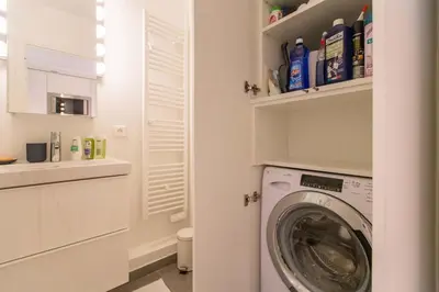 a laundry room with a washer and dryer at CENTRE PROMENADE Golden Square Terrace 1 min Walk to the Beach AC in Nice