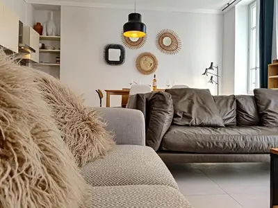 a living room with a leather couch and a table at Nestor&Jeeves - COLIBRI PRESTIGE - Central - Close sea in Nice