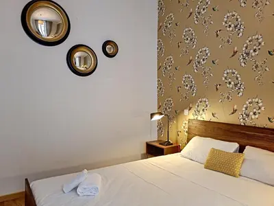 a bedroom with a bed and mirrors on the wall at Nestor&Jeeves - COLIBRI PRESTIGE - Central - Close sea in Nice